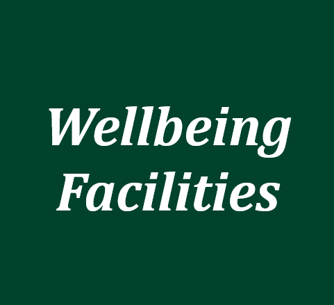 The words 'wellbeing facilities' in white text on a green background