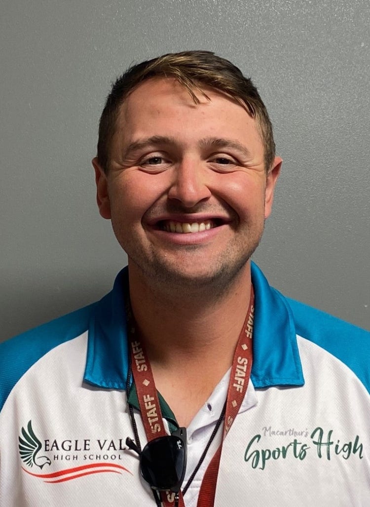 A picture of rugby league coach Harrison Fox wearing a Eagle Vale High School staff shirt.